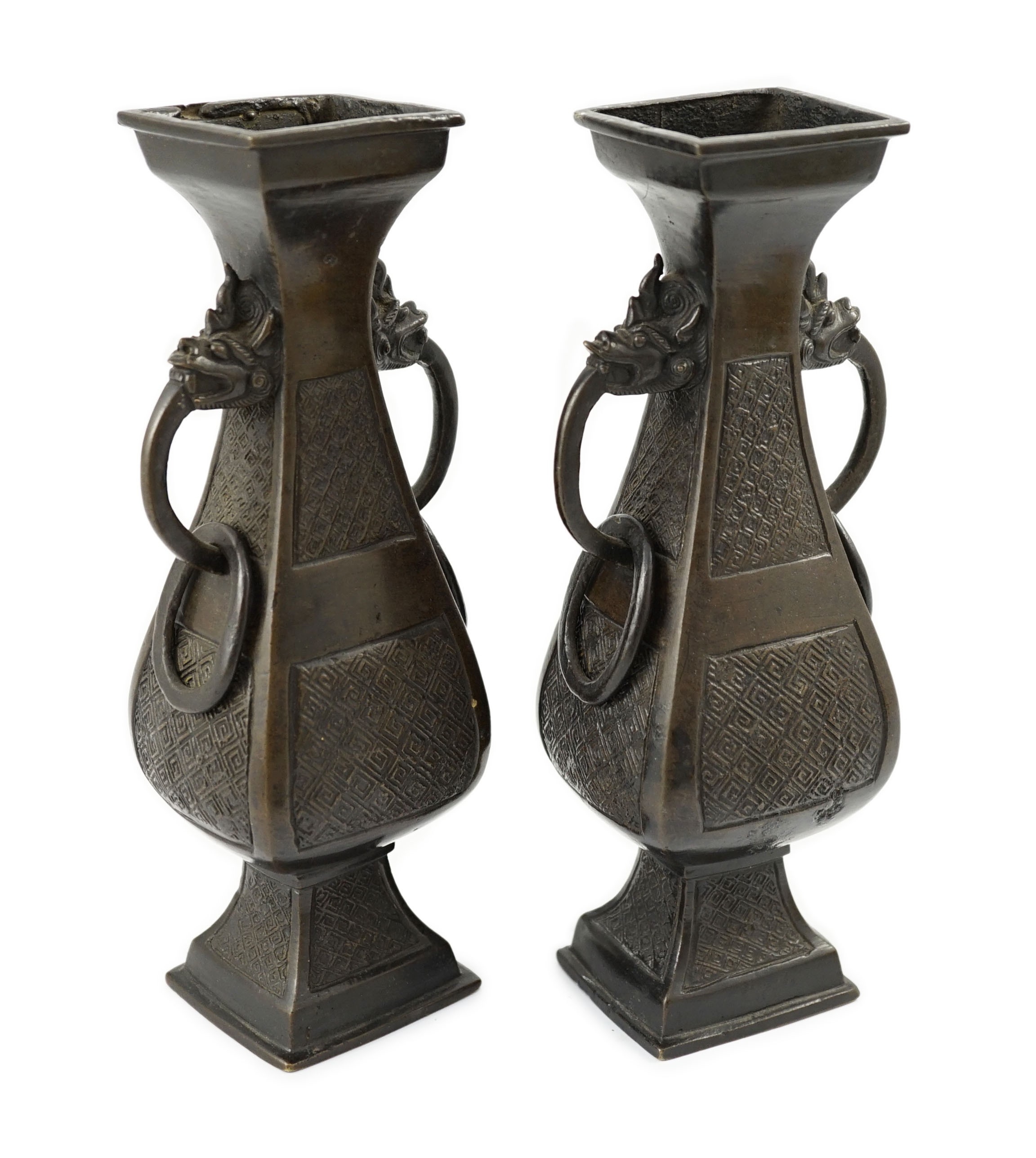A pair of Chinese archaistic bronze two handled altar vases, Ming dynasty, 23cm high